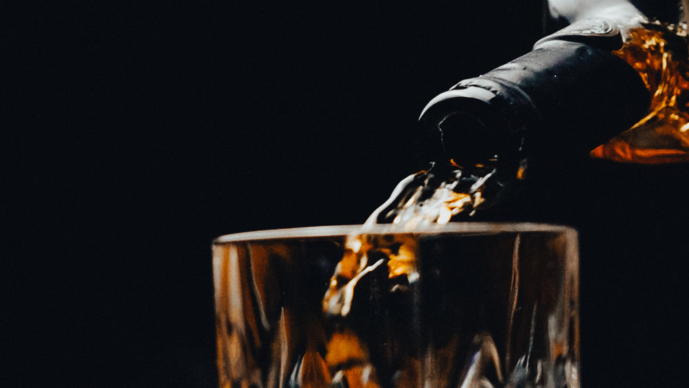 Pouring tequila into a glass